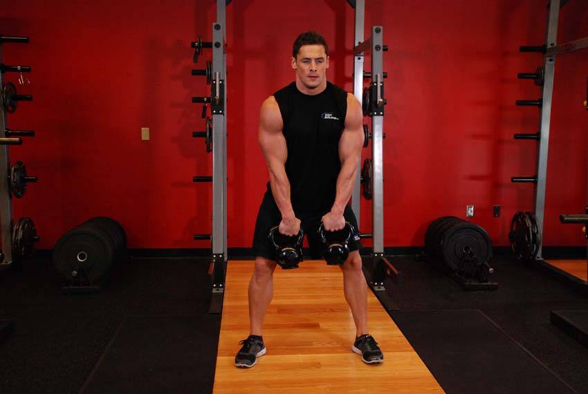 Double Kettlebell Alternating Hang Clean — starting position