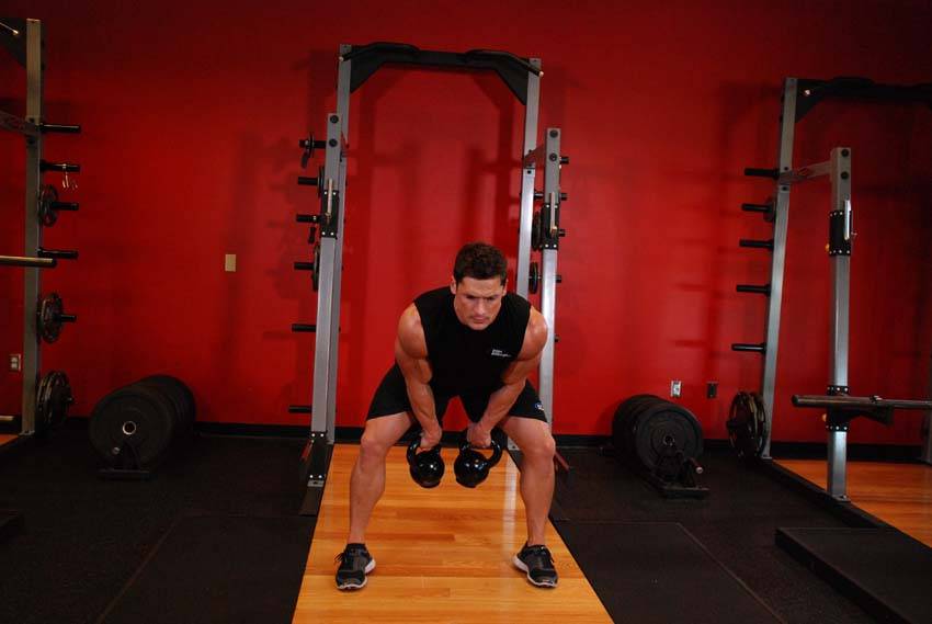 Double Kettlebell Snatch — end position