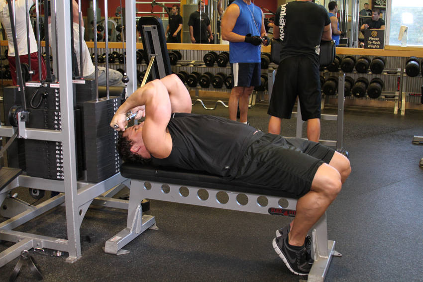 High Cable Curls — end position