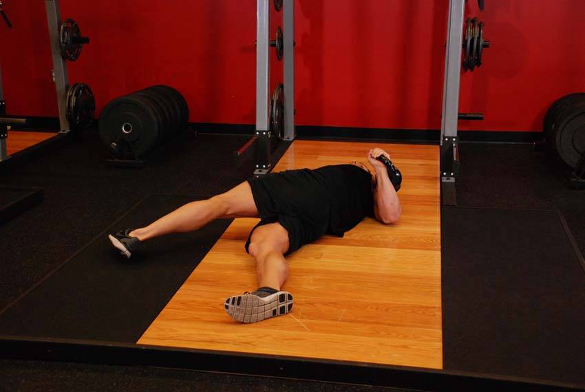 Leg-Over Floor Press — starting position