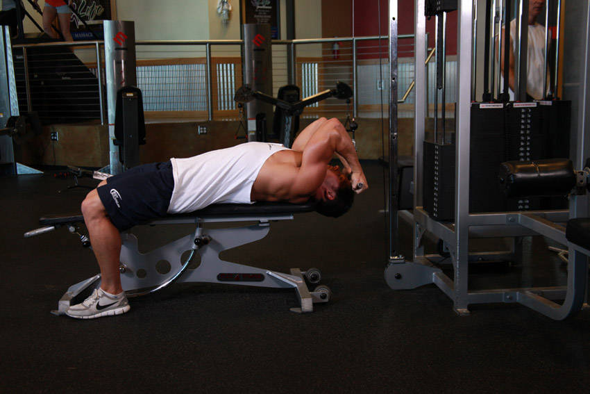 Lying Close-Grip Bar Curl On High Pulley — end position