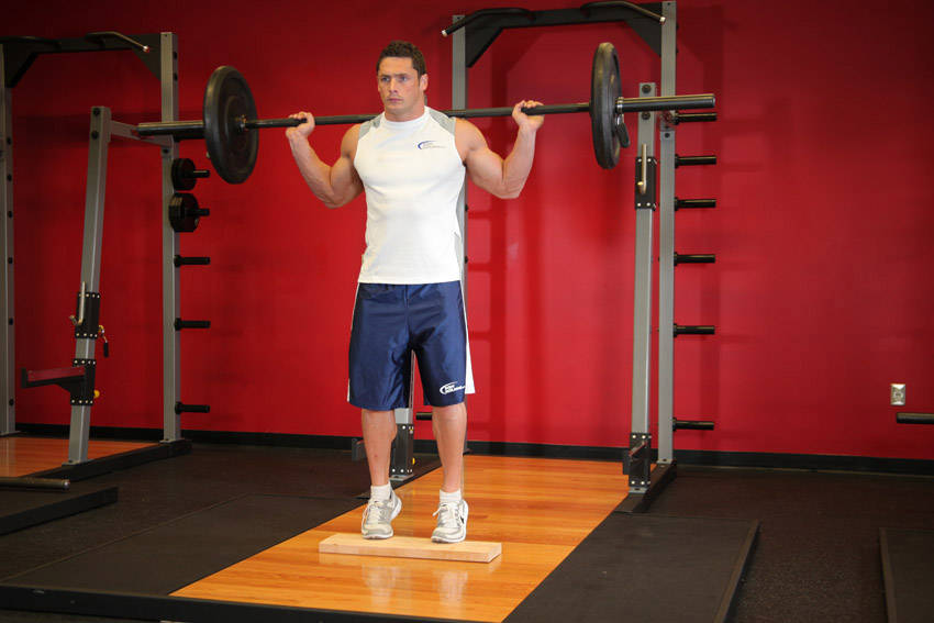 Standing Barbell Calf Raise — starting position